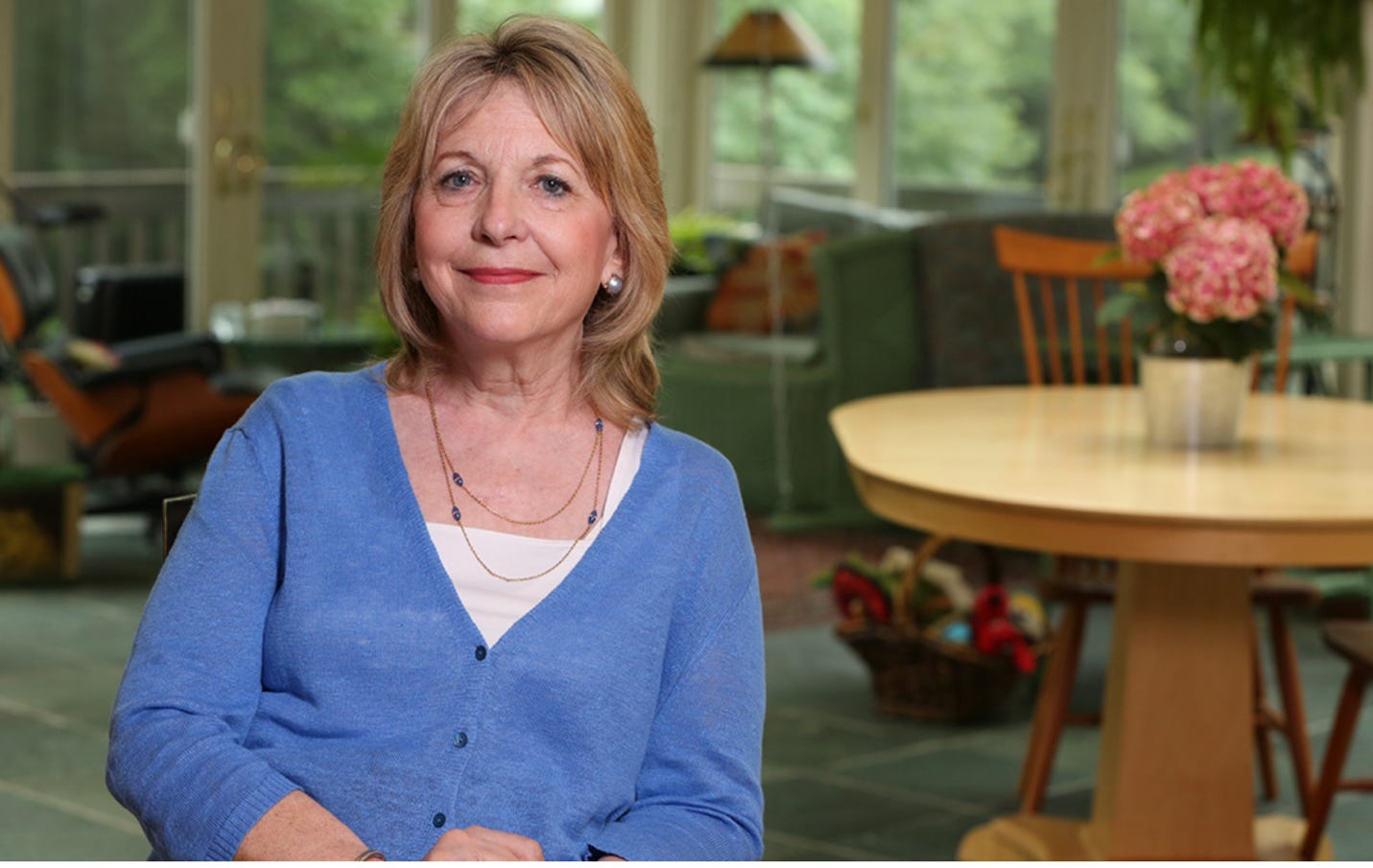 A person in a blue sweater

AI-generated content may be incorrect.