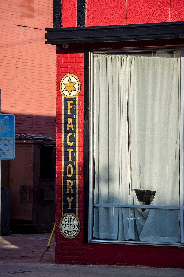 images of the outside of Factory City Tattoo, a red cinder block building
