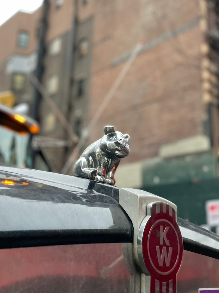 Chrome pig hood ornament on a big truck