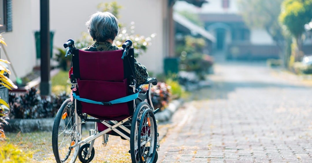 woman sitting on wheelchair woman sitting on wheelchair