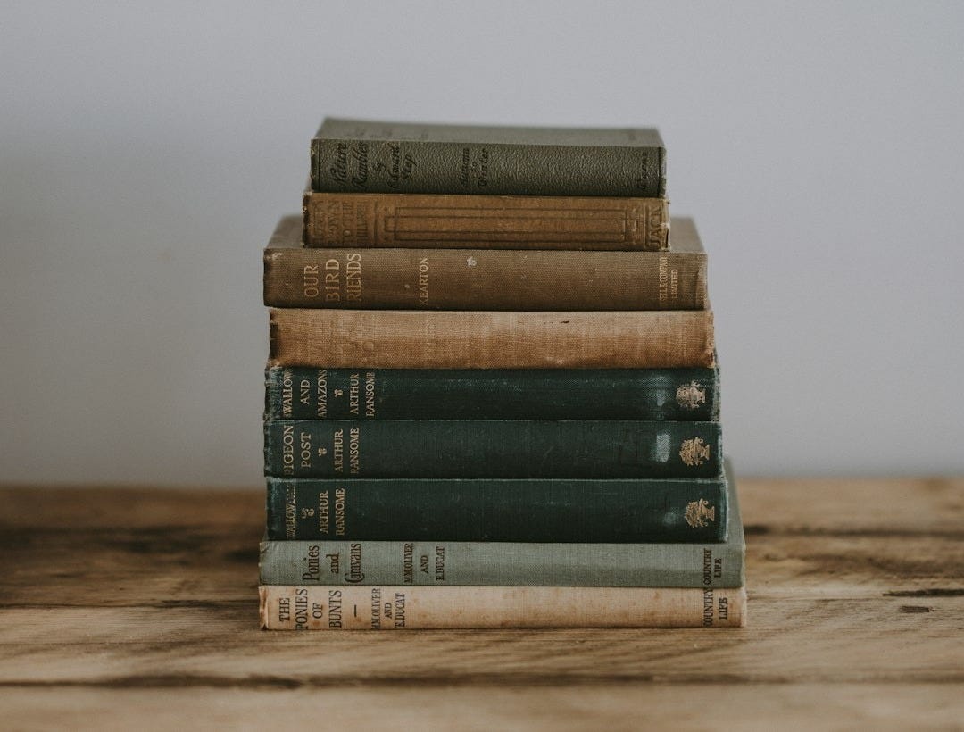 pile of Bible on brown surface