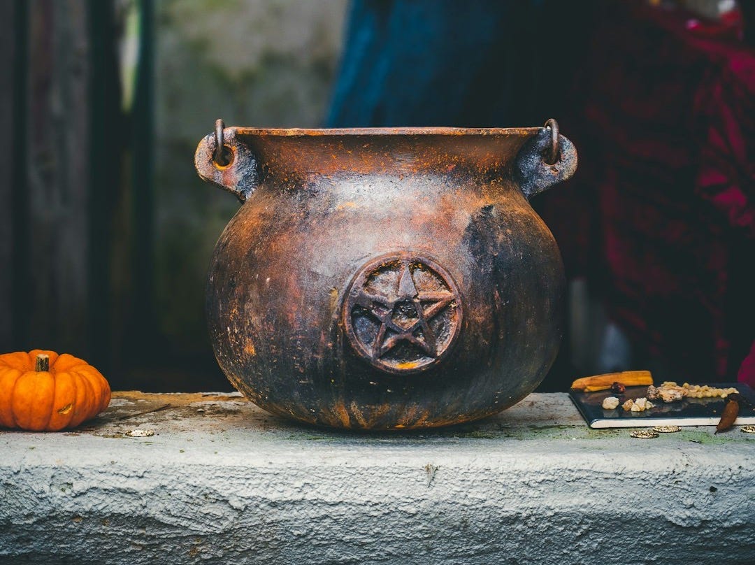 a vase with a face painted on it