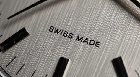 "Extreme macro shot of a vintage wristwatch face. Engraved text says “Swiss Made.” Brushed steel texture." - by GPT-4o, Imagen 4, and Seedream 3.0 image models