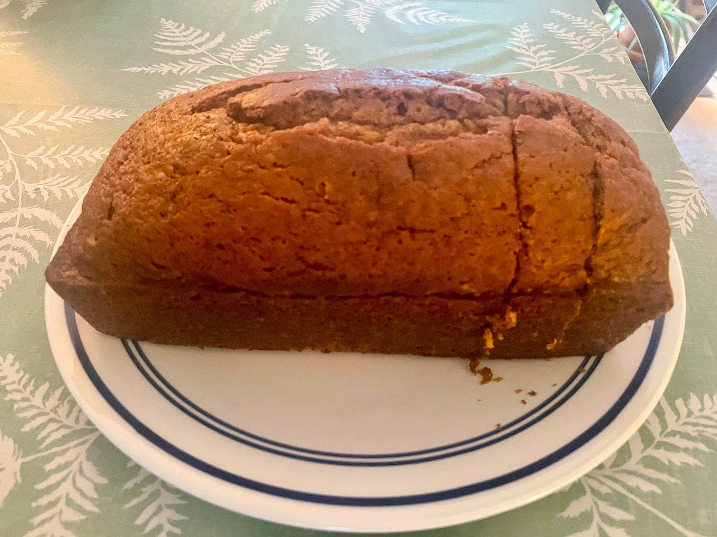 Loaf of pumpkin bread on a plate.