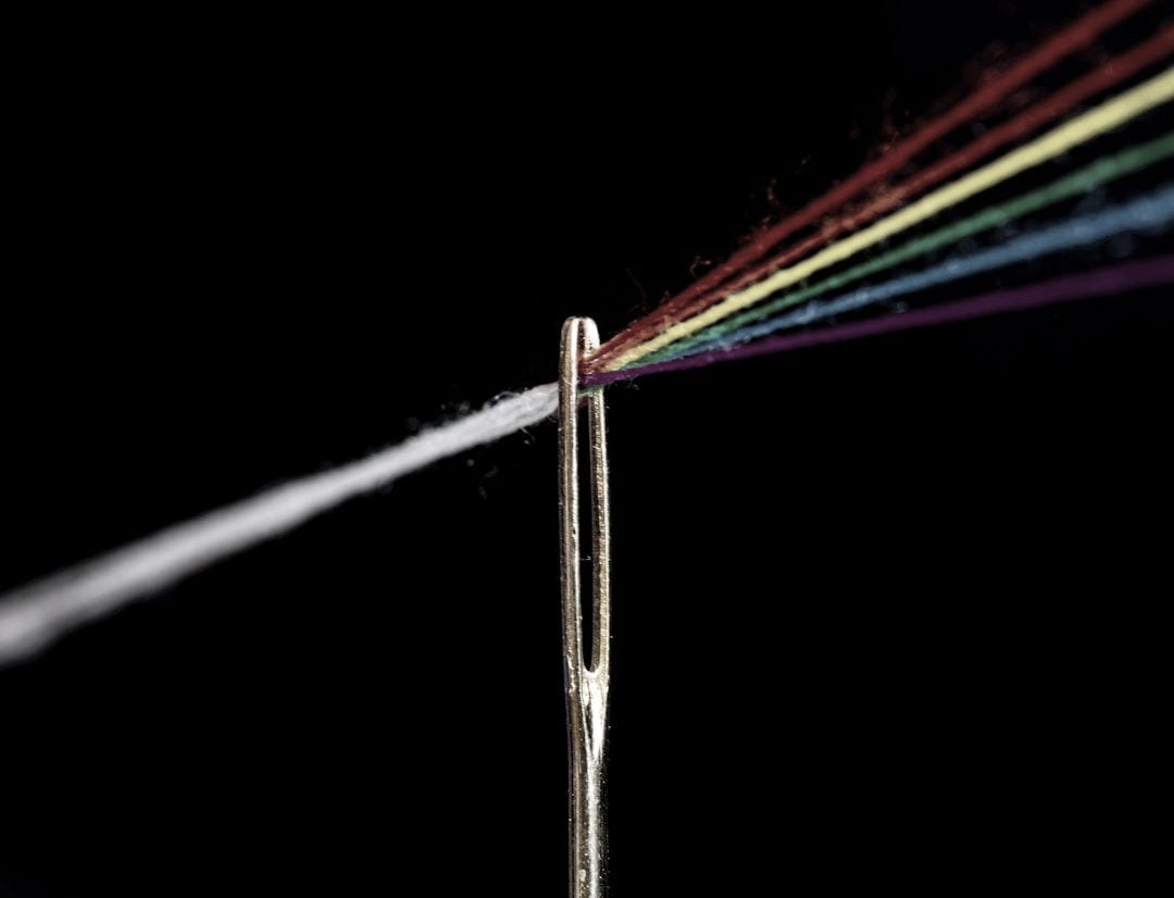 multi colored light streaks on white background