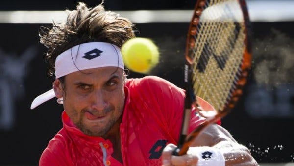 david ferrer returns hard serve to juan monaco at rio open 2015 images david ferrer returns hard serve to juan monaco at rio open 2015 images