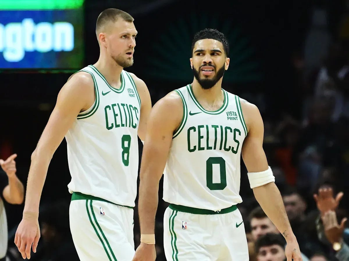 Kristaps Porzingis and Jayson Tatum of the Boston Celtics
