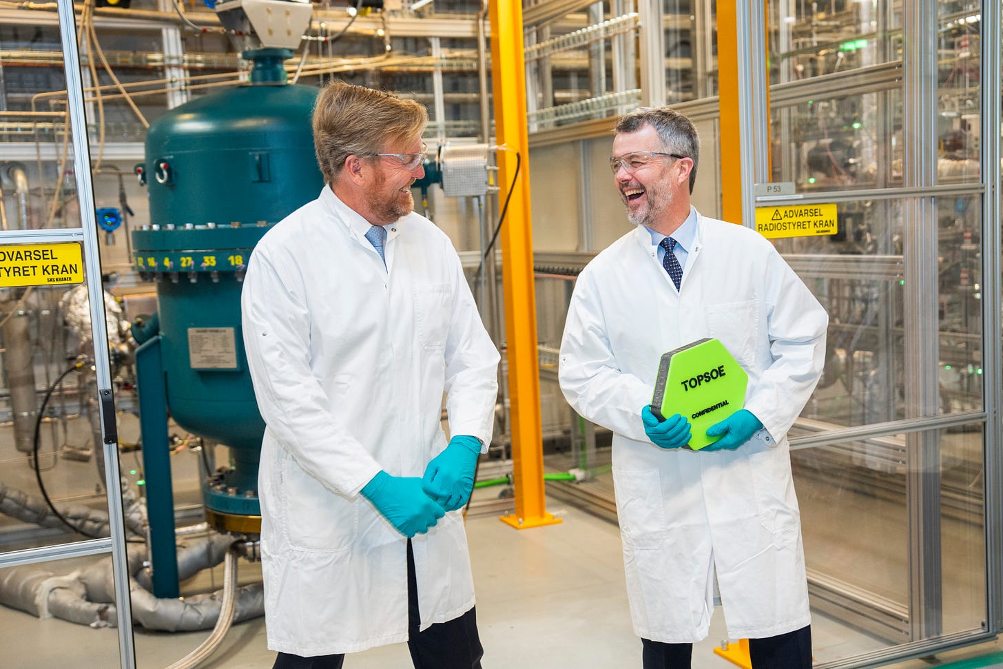 King Willem-Alexander and King Frederik wearing lab coats and laughing King Willem-Alexander and King Frederik wearing lab coats and laughing