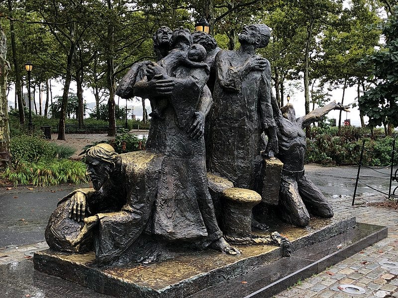 A statue of a group of people

Description automatically generated
