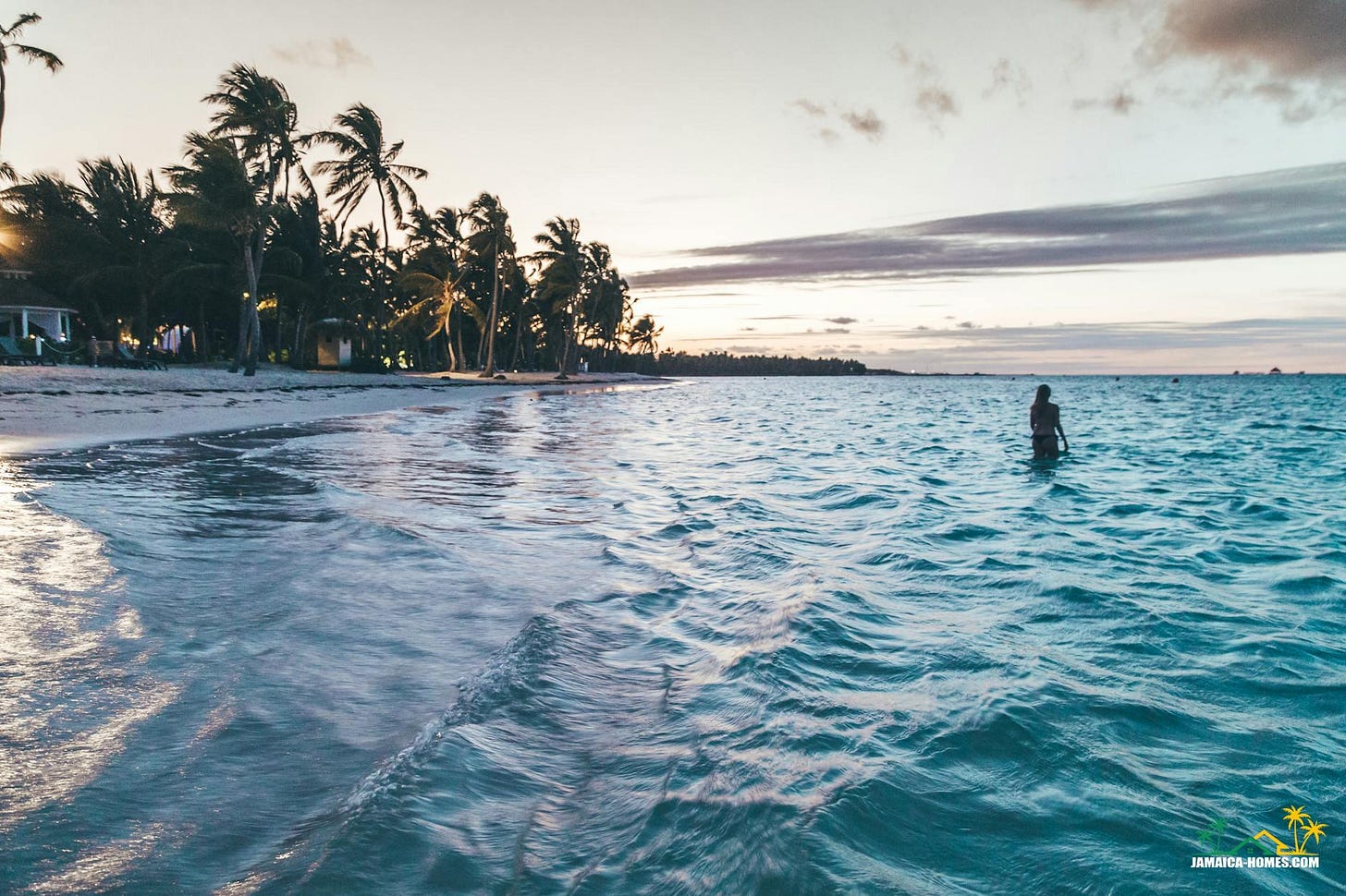 photo of person standing on beach