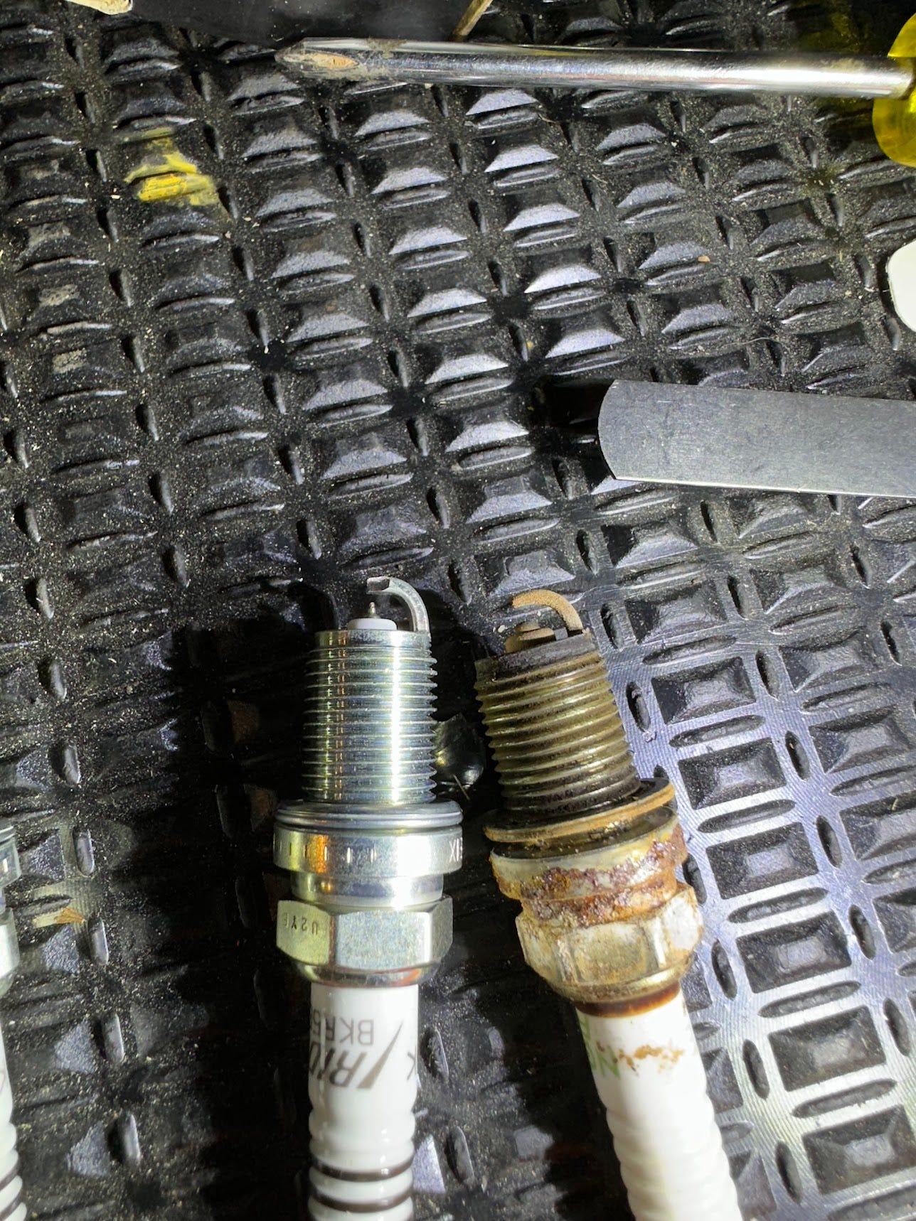 old and new spark plugs
