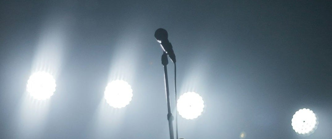 black microphone with stand