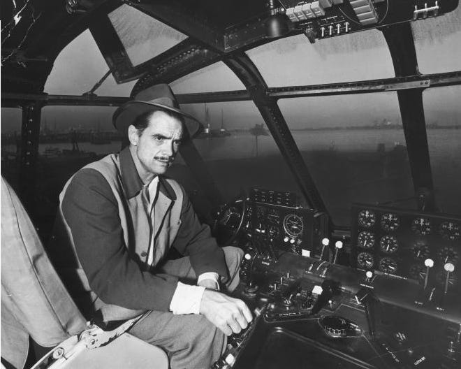 Eccentric billionaire Howard Hughes at the controls before the historic, solitary flight of his massive Spruce Goose H-4 flying boat in Long Beach, CA, November 1947.