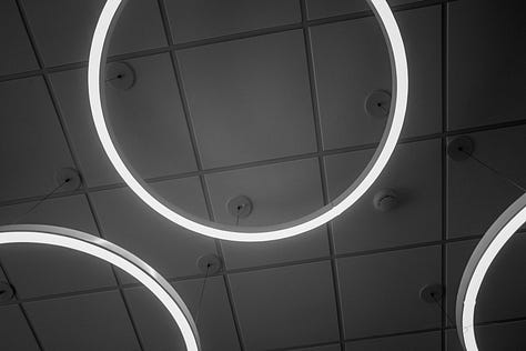 ceiling art, chessboard, sign in library that says "read," feng shui beads, artistic tree