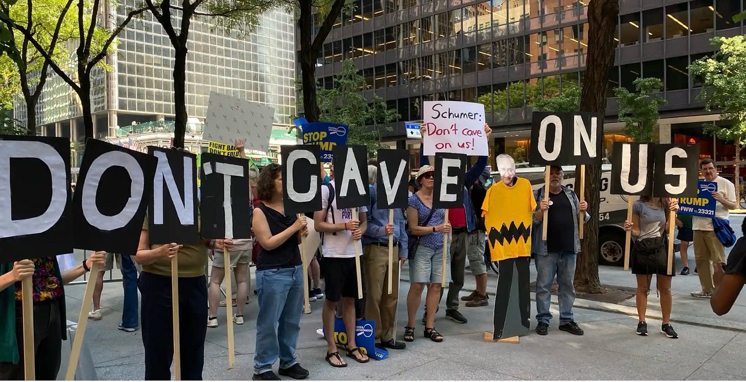 A group of people holding signs

AI-generated content may be incorrect.