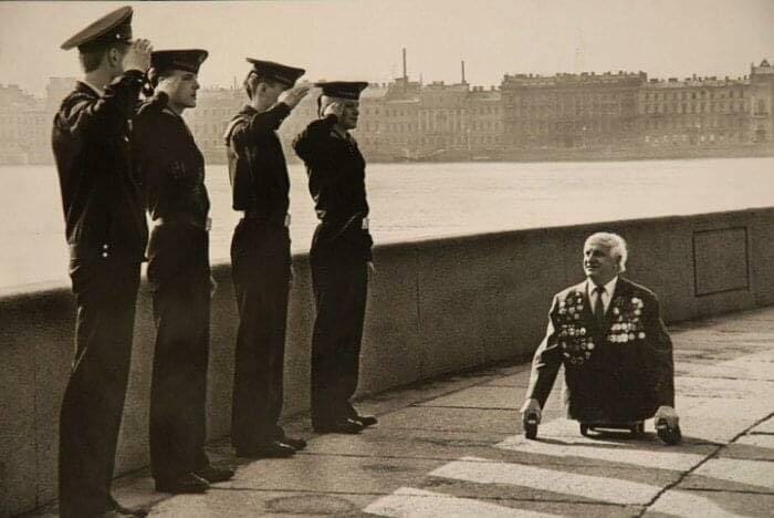 A moment of respect: sailors salute a war veteran in Leningrad (now St. Petersburg) in 1989.