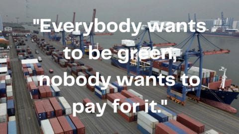 What text against a background photo of cranes and cargo ships in port