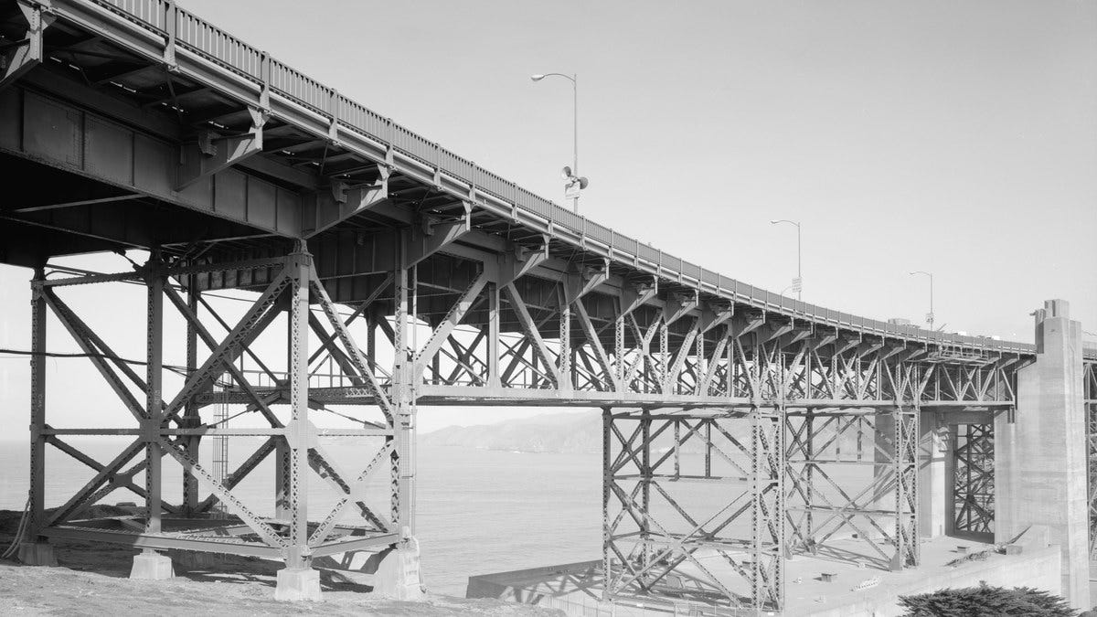 The steel truss understructure of the Golden Gate Bridge, every member carrying its share of the load