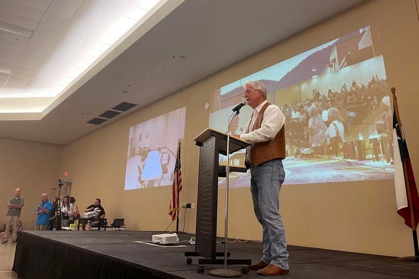 Kerr County Commissioner Rich Paces speaks to a crowd at an Election Integrity Town Hall he hosted at the Hill Country Youth Event Center on Aug. 22, 2023. Speakers at the event included Sen. Bob Hall and election conspiracy theorists Seth Keshel and Mark Cook, among others. Paces has since February been championing an effort to get rid of electronic voting equipment in Kerr County and to instead use volunteers to hand count ballots — a method that has been proven to be less accurate, less secure and more costly.