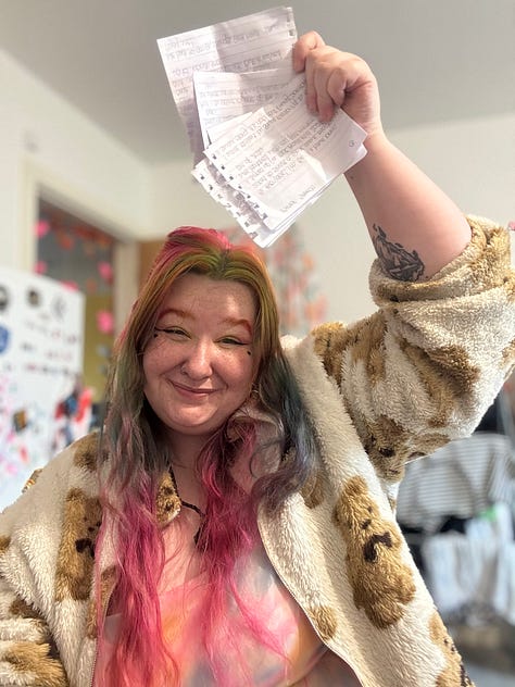 photo 1: An infographic showing MCR Pathways statistics for 2025, including numbers of young people matched with mentors, regional breakdowns across the UK, mentor figures, and total volunteer hours contributed over recent years.  photo 2: A person smiling warmly at the camera indoors, with brightly coloured rainbow hair, green and pink makeup, and a soft patterned jacket. They are seated in a wheelchair that isn’t fully visible in the frame, with a cosy room and decorations in the background.  photo 3: The same person smiling and holding a fan of handwritten speech cue cards above their head. They are wearing a fluffy patterned jacket and have colourful hair, with part of a kitchen behind them.