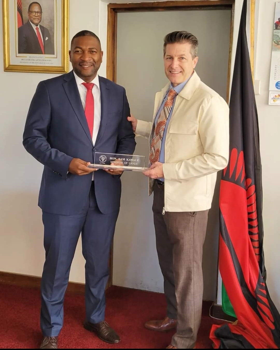 May be an image of 3 people, people standing and suit