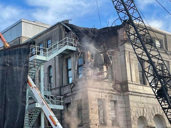 Wrecking ball knocking down old Rock Island County Courthouse Wrecking ball knocking down old Rock Island County Courthouse