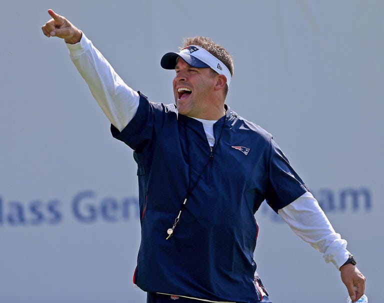 New England Patriots offensive coordinator Josh McDaniels yells out during training camp at Gillette Stadium on July 30, 2021, in Foxboro, Massachusetts.