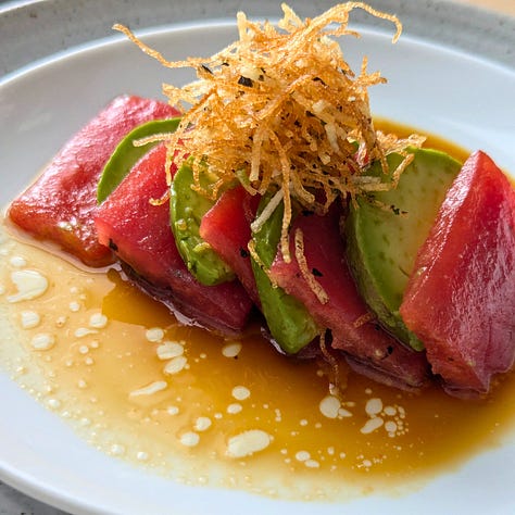 Three dishes finished with ponzu: tofu and seared tomato sushi, chilled hiyayakko with furikake, and tomato “tuna” sashimi — each showcasing ponzu’s bright, savory balance.