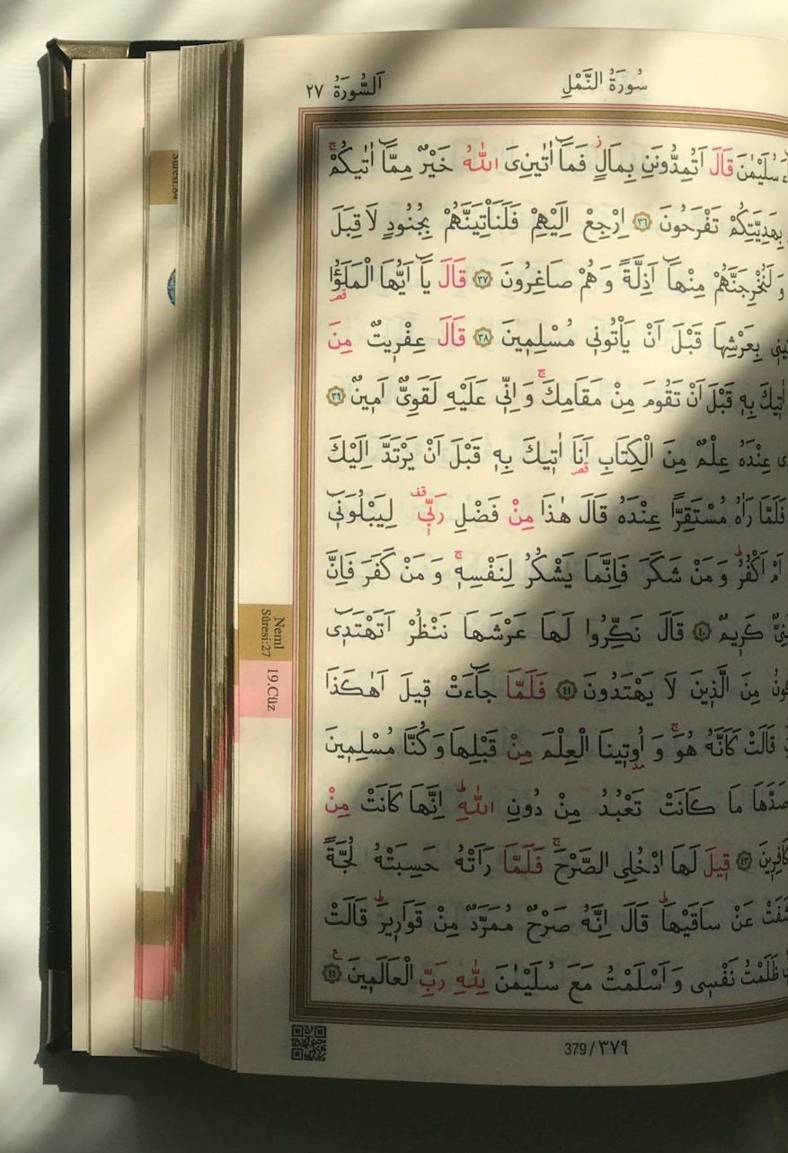 An open book sitting on top of a table An open book sitting on top of a table