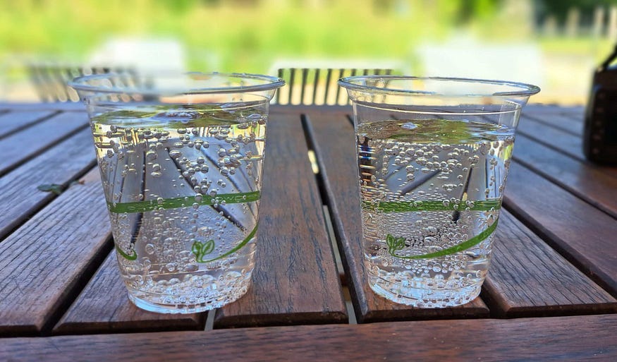 Two glasses on lemonade on a table