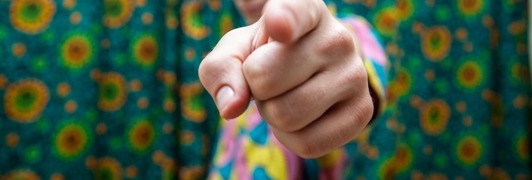 man pointing at camera