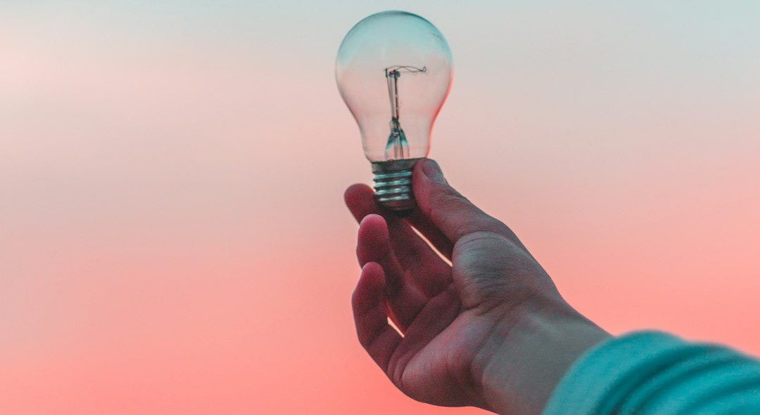 person holding light bulb