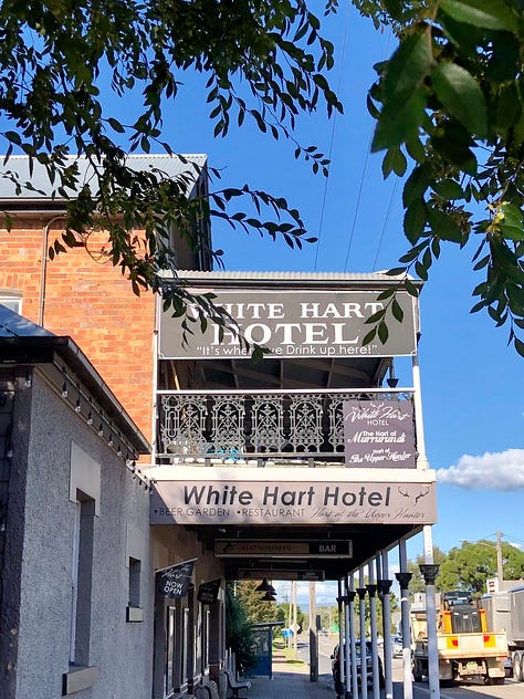 Exterior hotel, book cover and a single bed