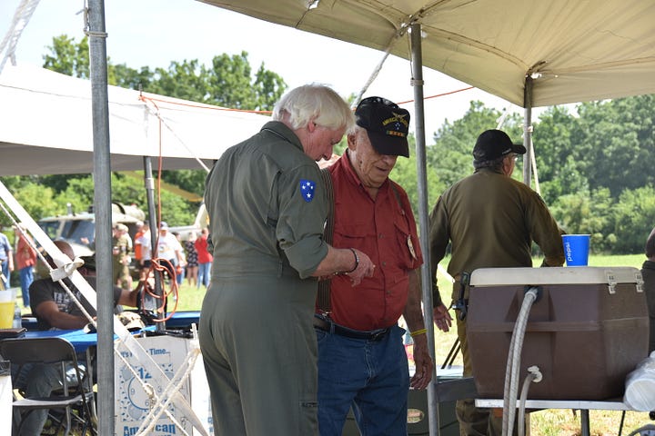 Scenes from American Huey 369 Patriot Day with pilots and volunteers.