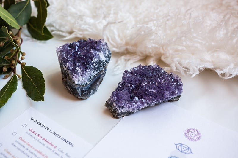 two amethyst stones, rough cut