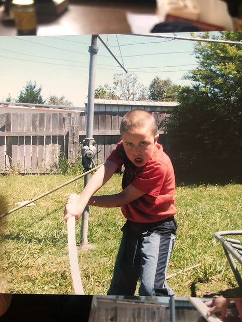Gaden aged 8 plays with swords. They are very serious and concentrated.