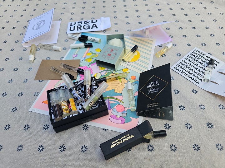 Samples of perfumes on a table, sample of trudon wax seal 