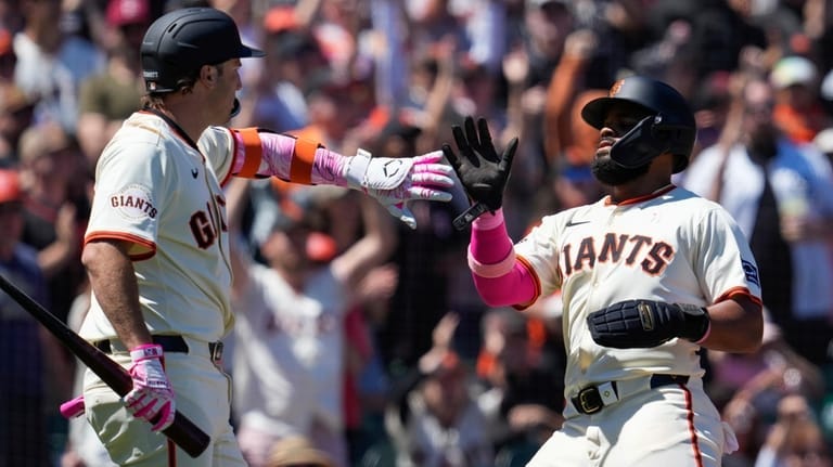 San Francisco Giants' Heliot Ramos, right, celebrates with Casey Schmitt,... San Francisco Giants' Heliot Ramos, right, celebrates with Casey Schmitt,...
