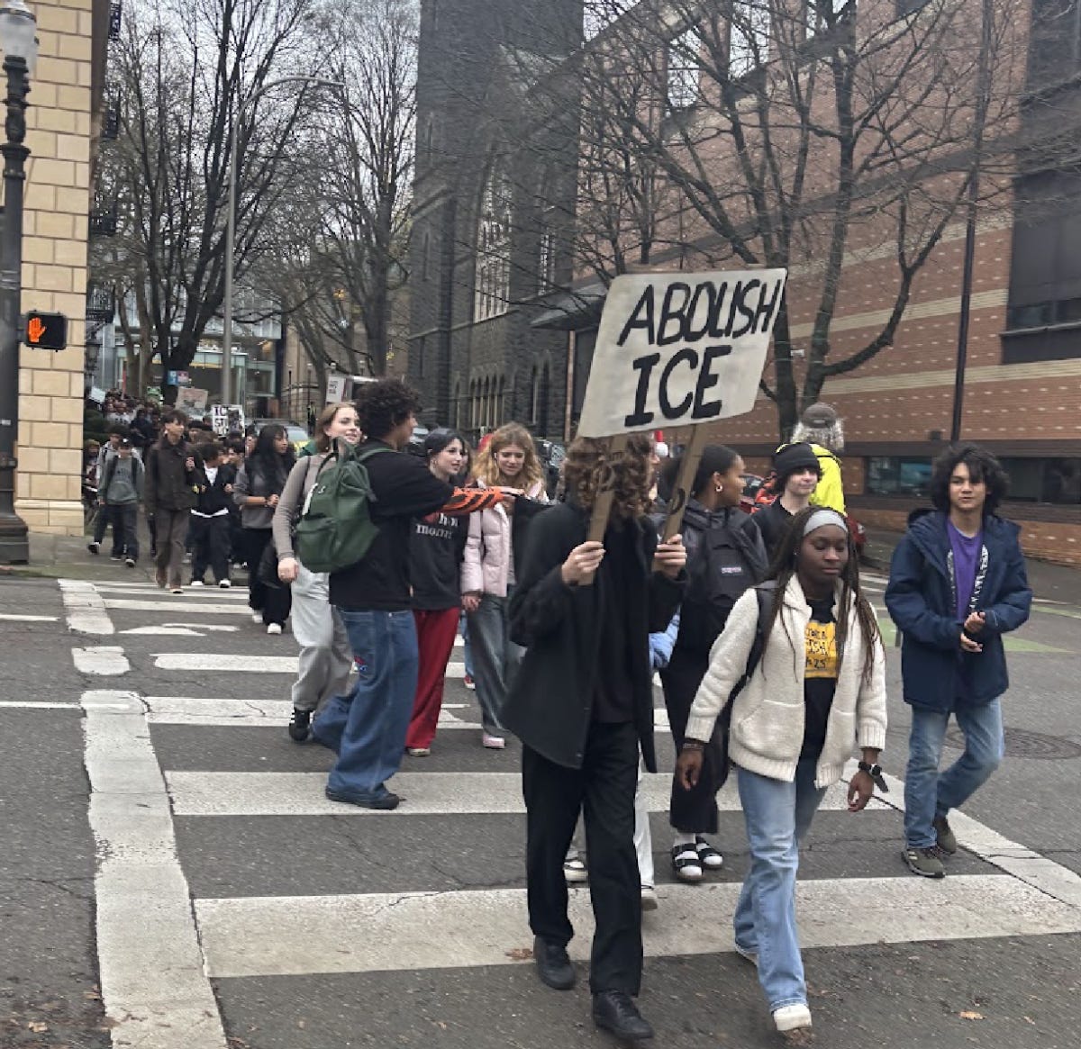 Students yell chants such as “No hate, no fear, immigrants are welcome here” as they walk to City Hall. By Hana Fares Students yell chants such as “No hate, no fear, immigrants are welcome here” as they walk to City Hall. By Hana Fares