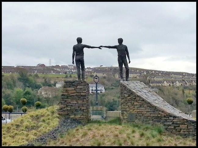 Hands Across the Divide – The Rambling Wombat