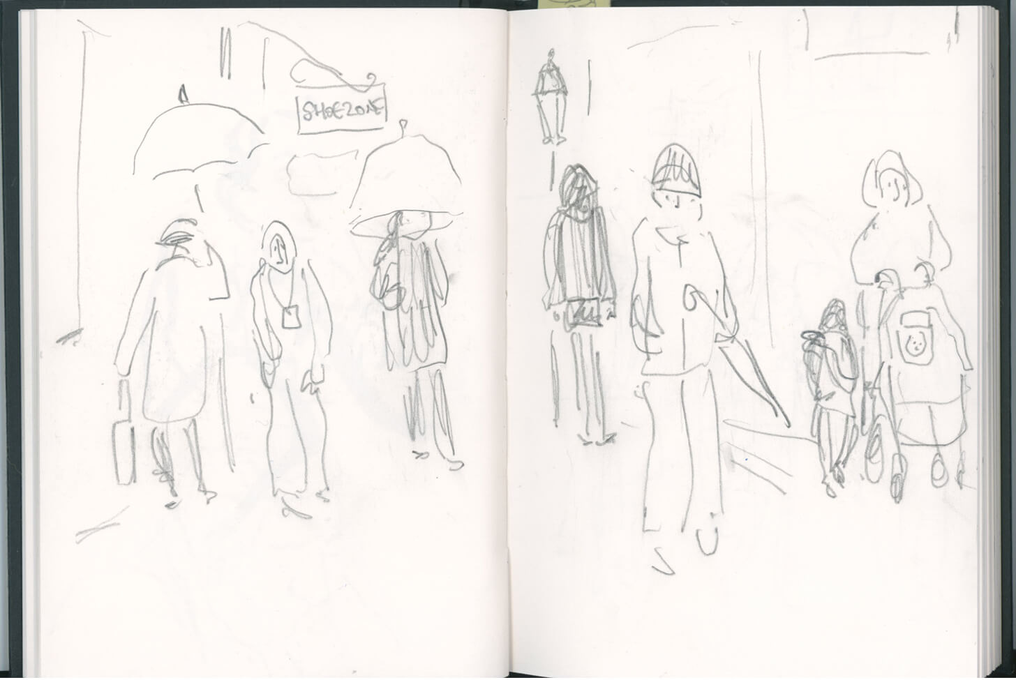 Image of sketchbook page showing loose drawings of figures with umbrellas walking down a street. By Nanette Regan