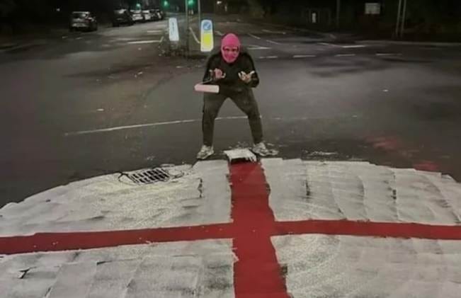 A person in a pink mask holding a roll

AI-generated content may be incorrect.