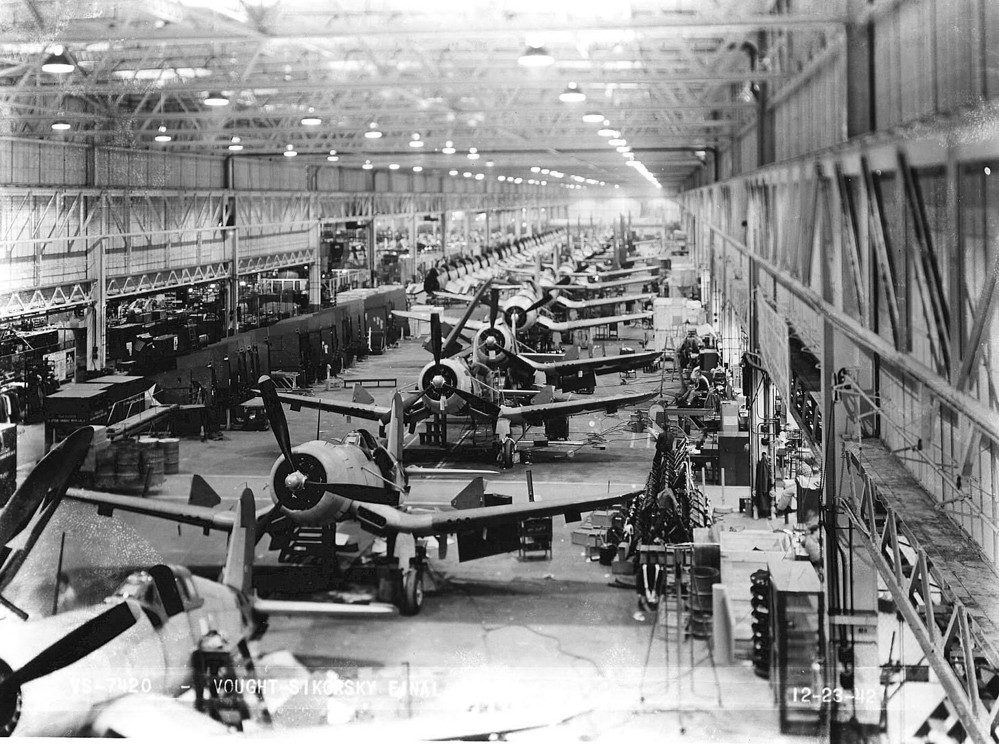 F4U-1 Corsairs, symbols of wartime aerial power, emerge from the assembly line at the Vought-Sikorsky plant in Stratford, CT, 1942.