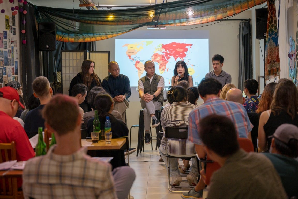 A panel of five journalists and advocates (Shirley Leung Ka Lai, Editor-in-Chief, Photon Media; Aleksandra Bielakowska, Advocacy Manager and Taiwan Chapter - Chairperson, Reporters Without Borders (RSF) ; Will Yang, journalist and member of the standing executive committee, the Association of Taiwan Journalists (ATJ) ; Long Huu Trinh, journalist and Interim Executive Director, Legal Initiatives for Vietnam ; Brian Hioe, founding editor of New Bloom and TFCC board director) speak in front of a seated audience at Daybreak.
