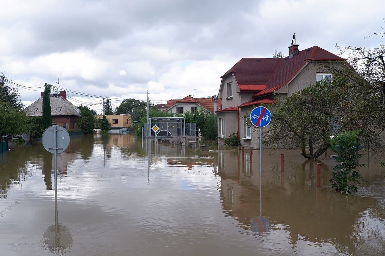 A suburban street surrounded by floodwaters