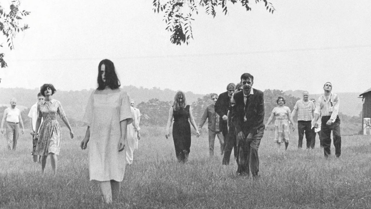 still from night of the living dead; a bunch of zombies wandering towards you in a field
