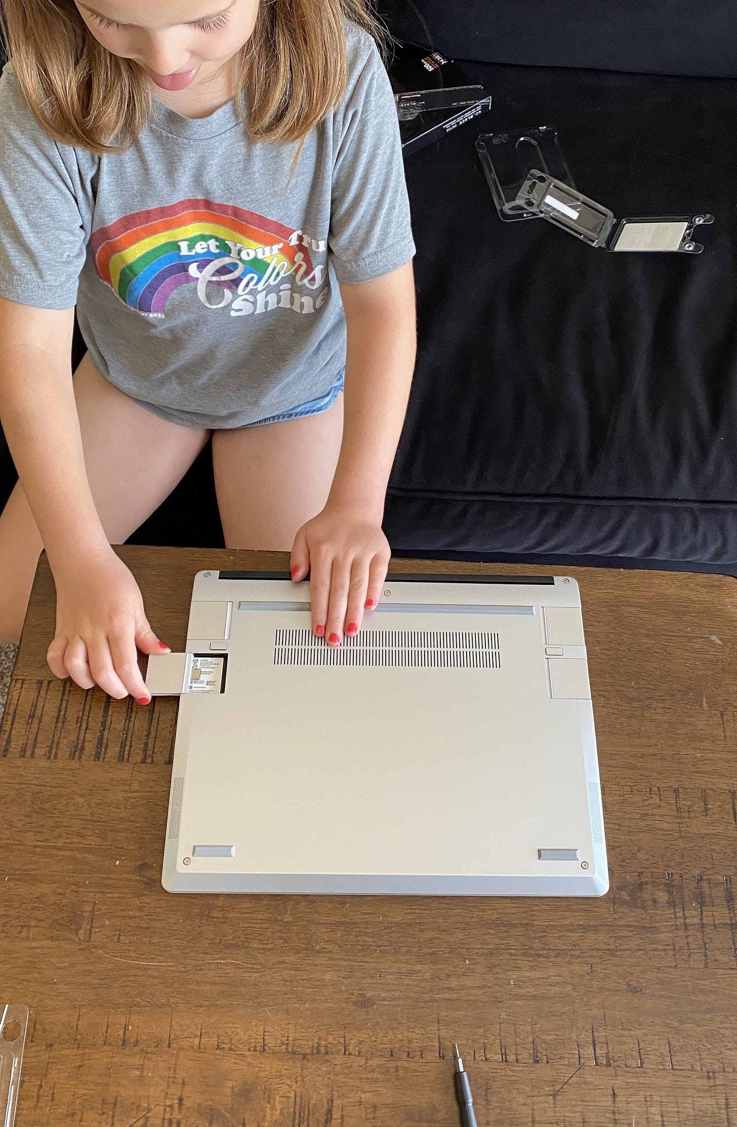 a photo showing installation of Framework Laptop expansion cards a photo showing installation of Framework Laptop expansion cards