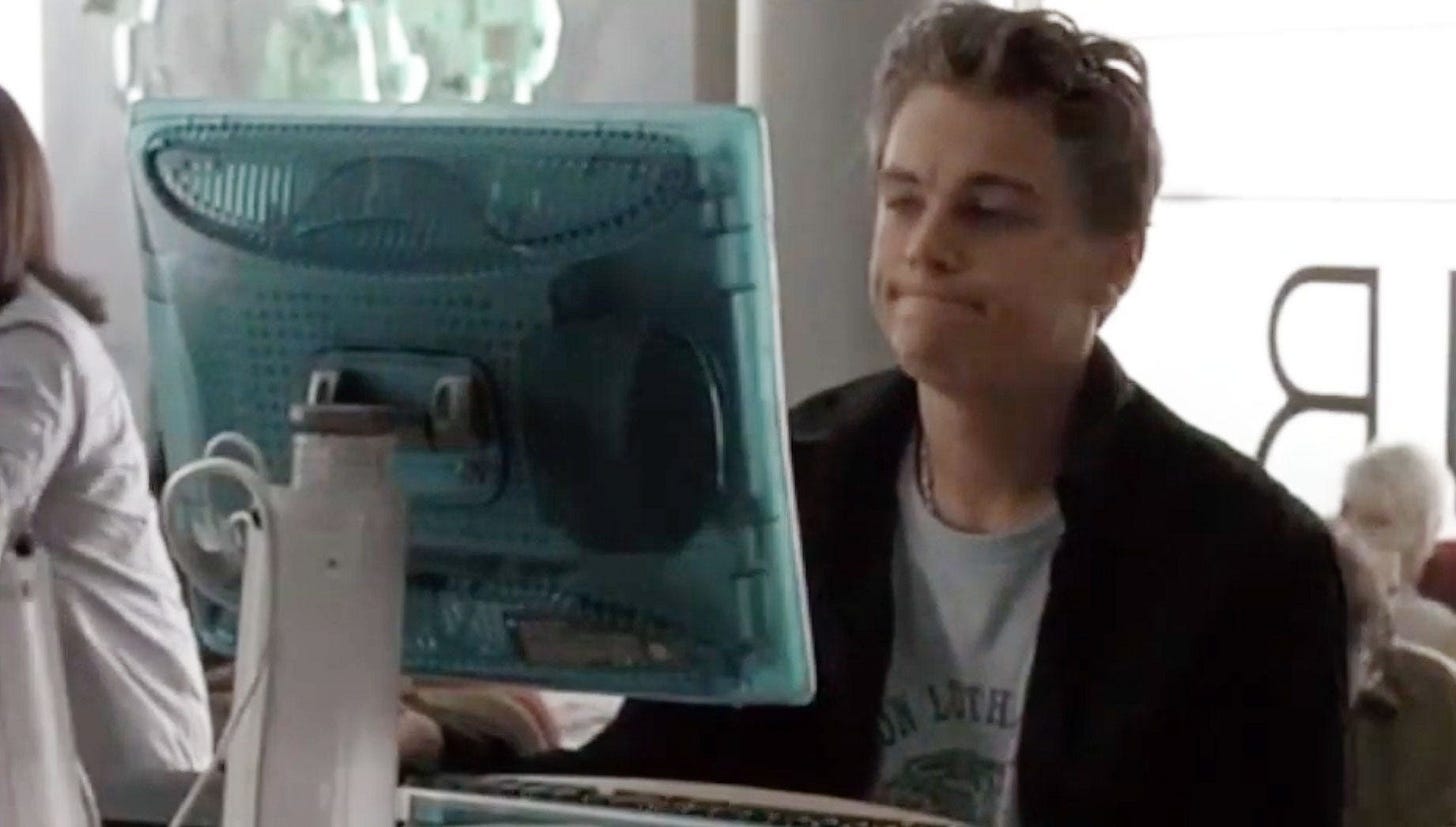 A picture of Leonardo Dicaprio frowning in front of a computer