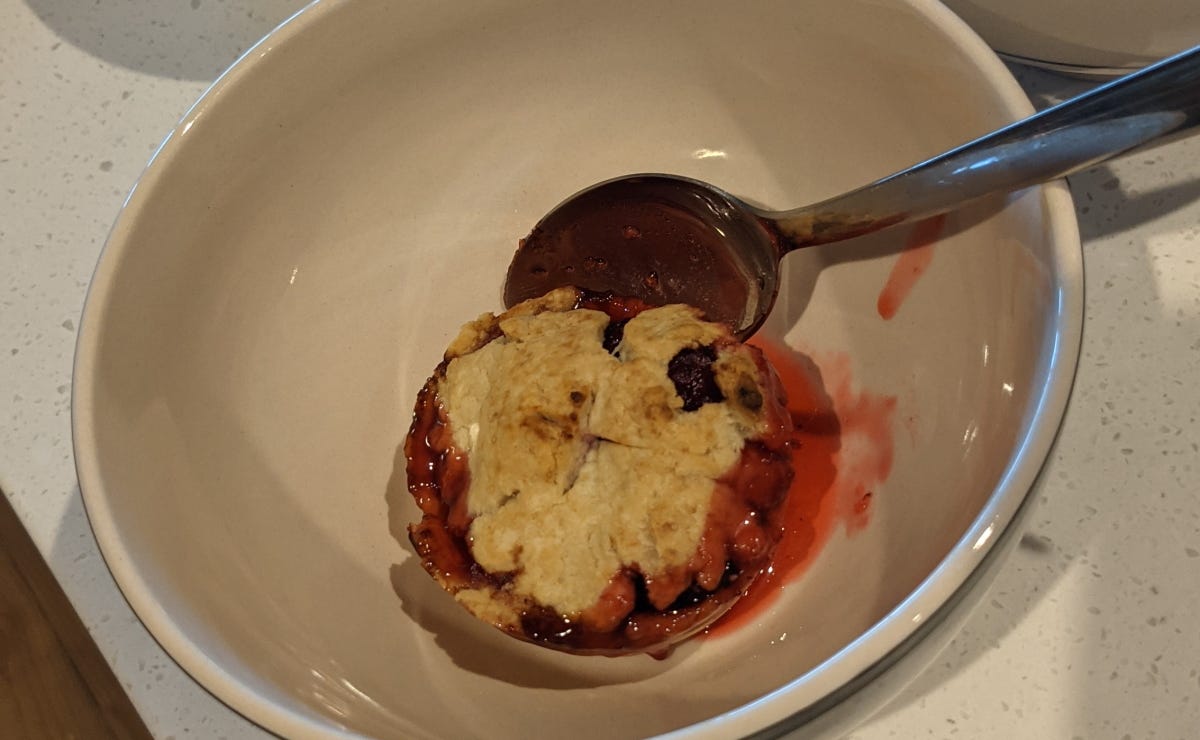 A pie in a bowl, about to be consumed