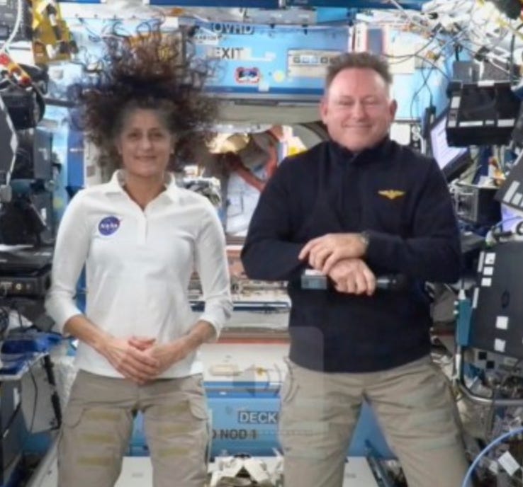 A person and person standing in a room with many electronic equipment

AI-generated content may be incorrect.